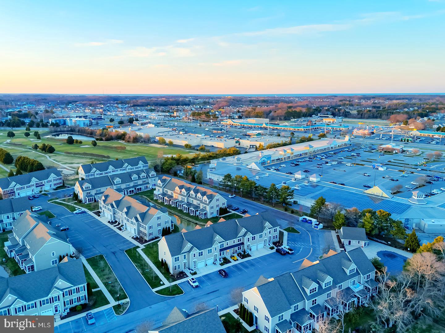 18799 Bethpage Drive, Unit 16E Lewes, DE 19958 - Photo 68 of 68 an aerial view of a city with lots of residential buildings ocean and mountain view in back