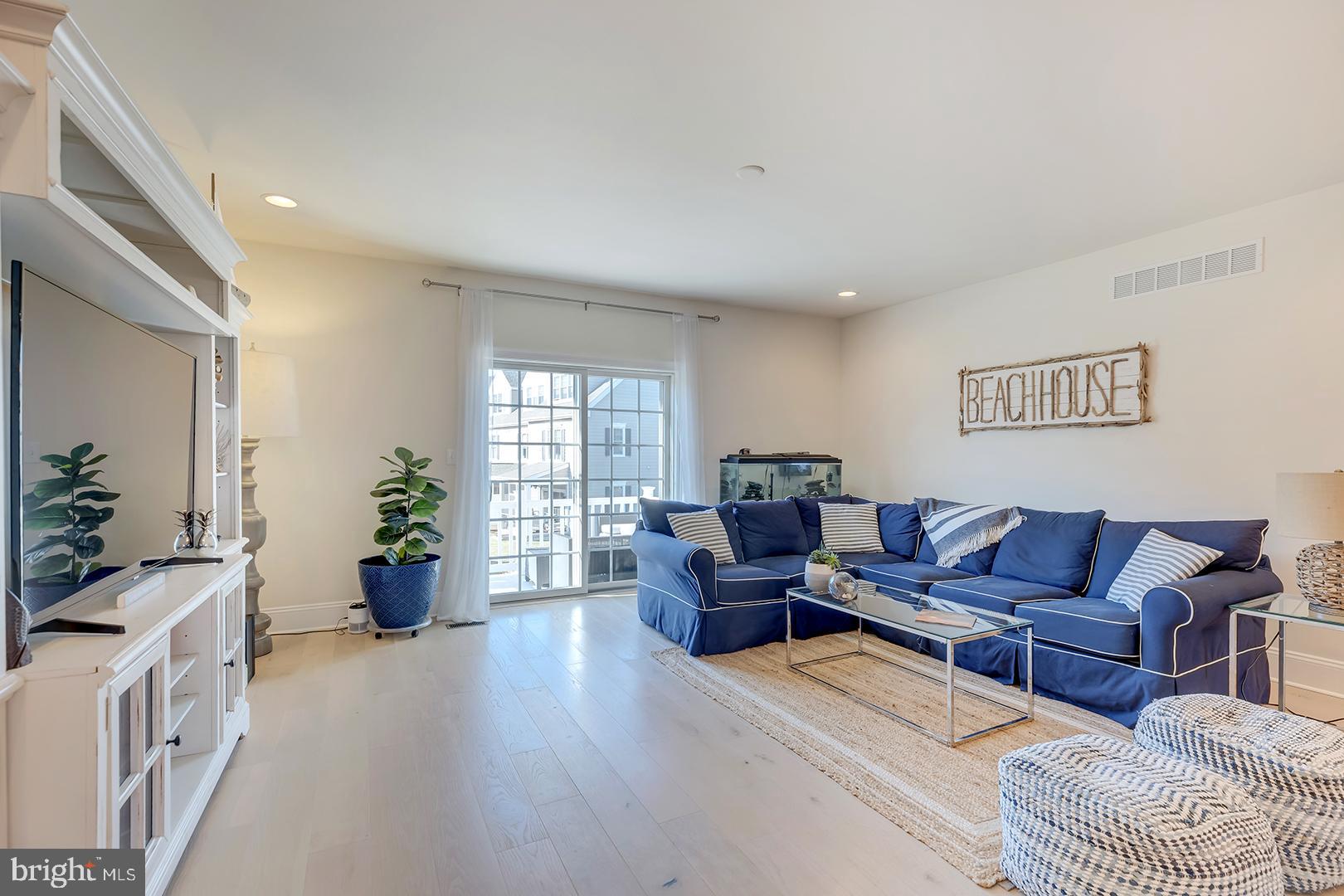 18799 Bethpage Drive, Unit 16E Lewes, DE 19958 - Photo 8 of 68 a living room with furniture and a couch