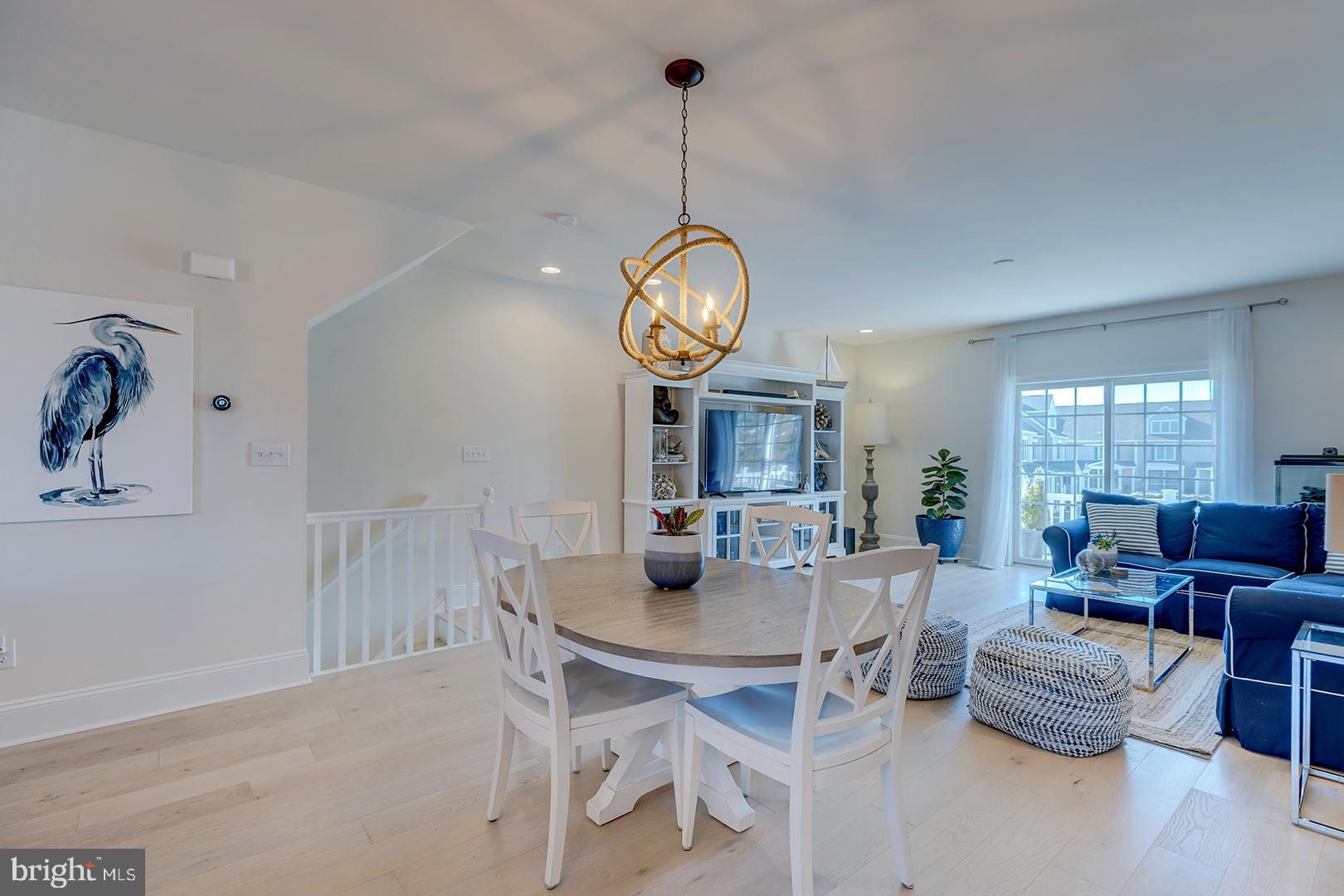 18799 Bethpage Drive, Unit 16E Lewes, DE 19958 - Photo 10 of 68 a view of a dining room with furniture window and wooden floor