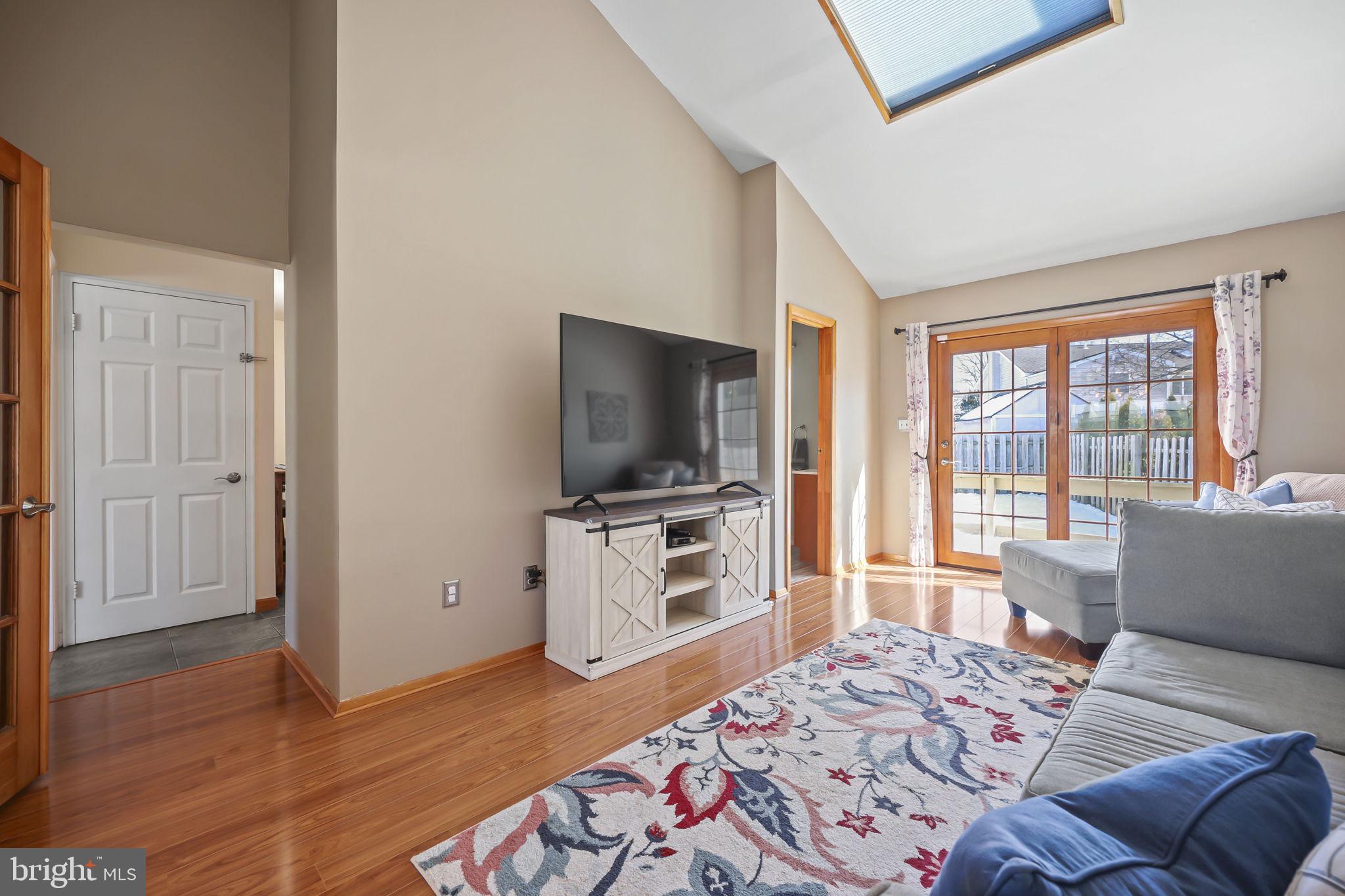 17 Maguire Road Hamilton, NJ 08690 - Photo 11 of 37 a living room with a flat screen tv and a couch