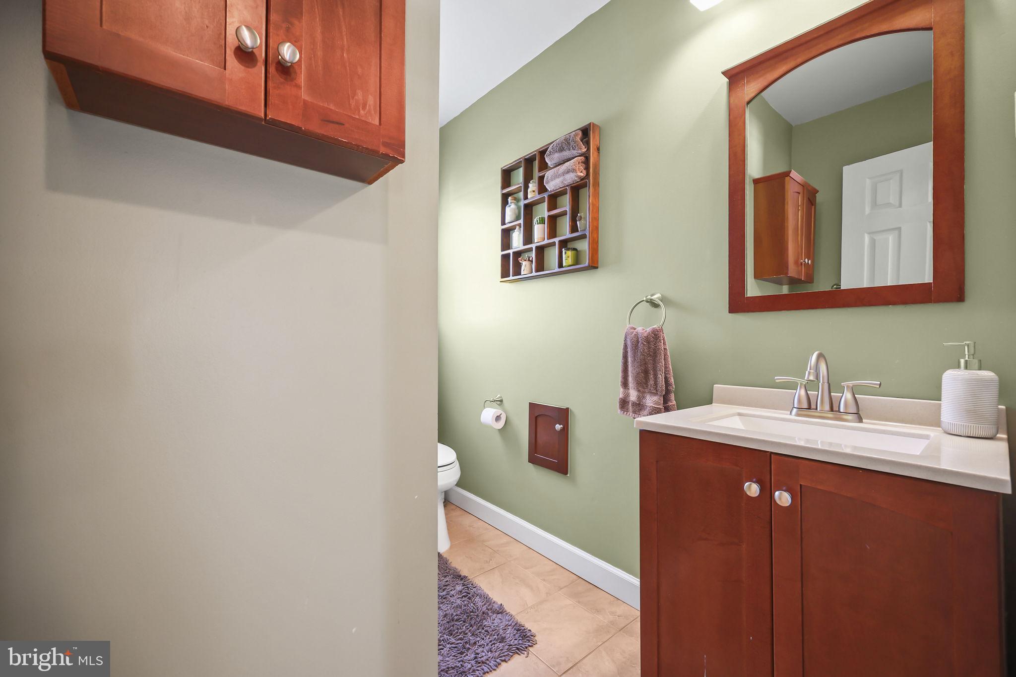 17 Maguire Road Hamilton, NJ 08690 - Photo 21 of 37 a bathroom with a sink vanity and mirror