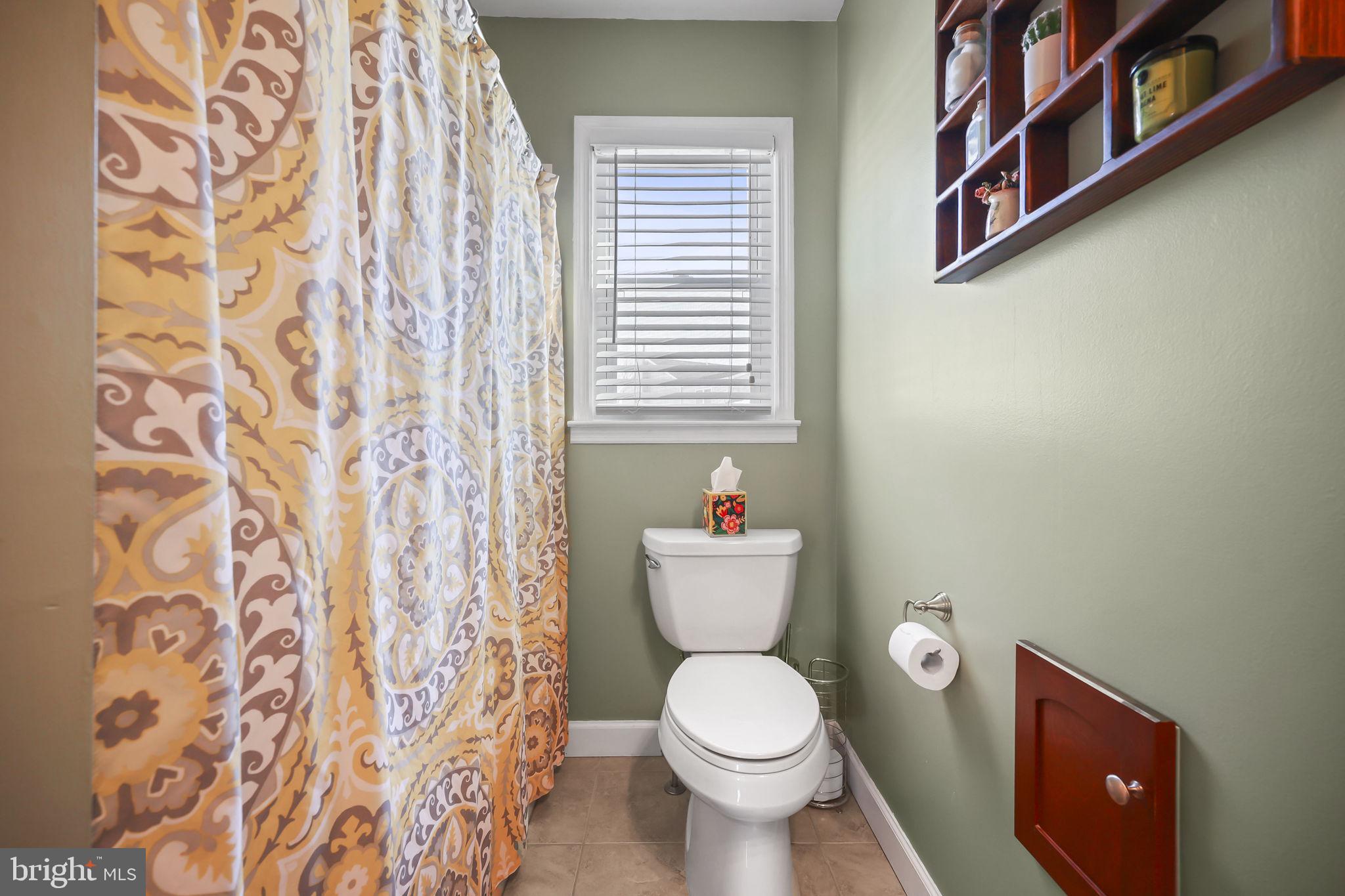 17 Maguire Road Hamilton, NJ 08690 - Photo 22 of 37 a white toilet sitting next to a shower curtain