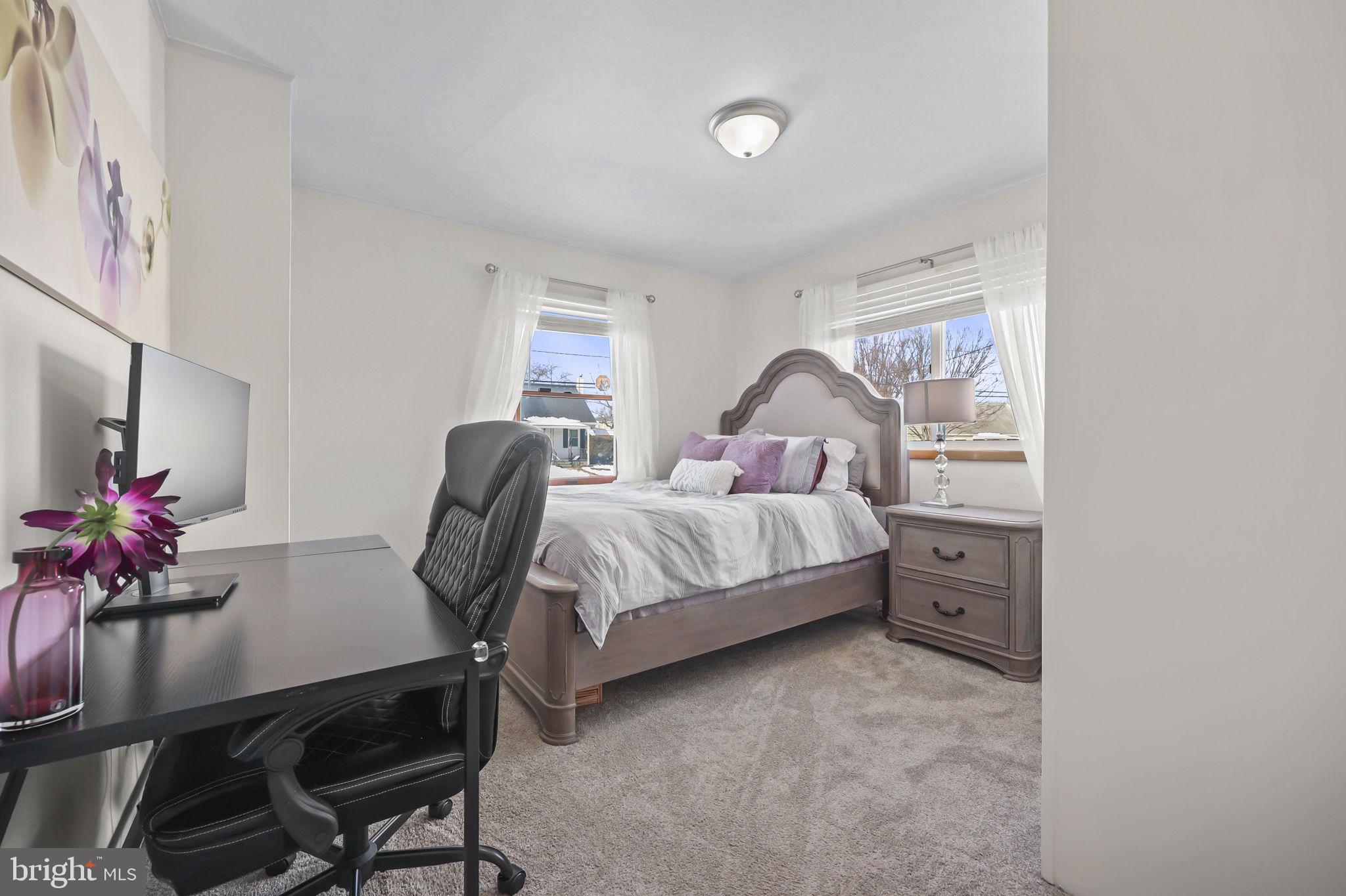 17 Maguire Road Hamilton, NJ 08690 - Photo 24 of 37 a bedroom with a bed table chair and a window