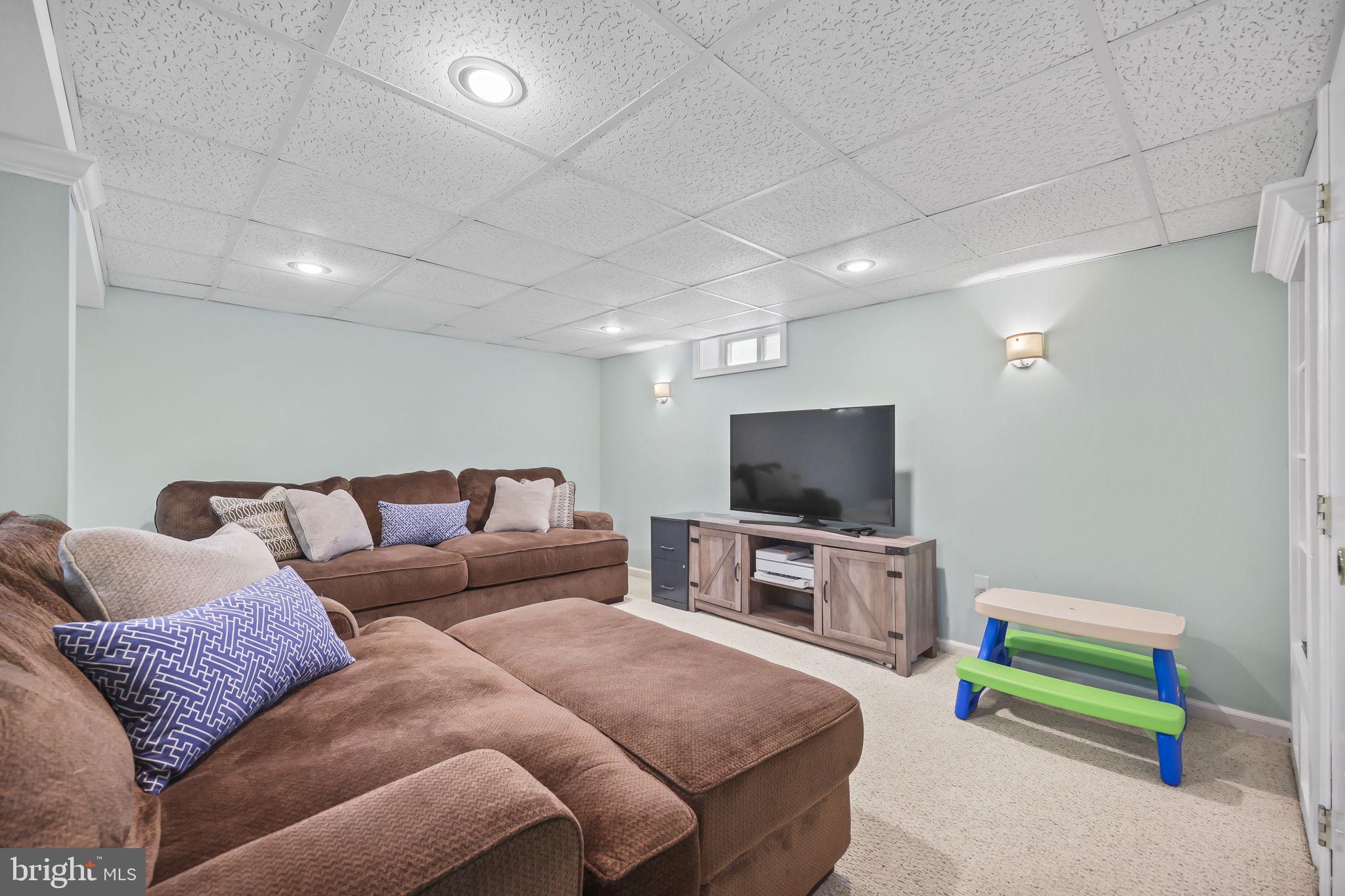 17 Maguire Road Hamilton, NJ 08690 - Photo 29 of 37 a living room with furniture and a flat screen tv
