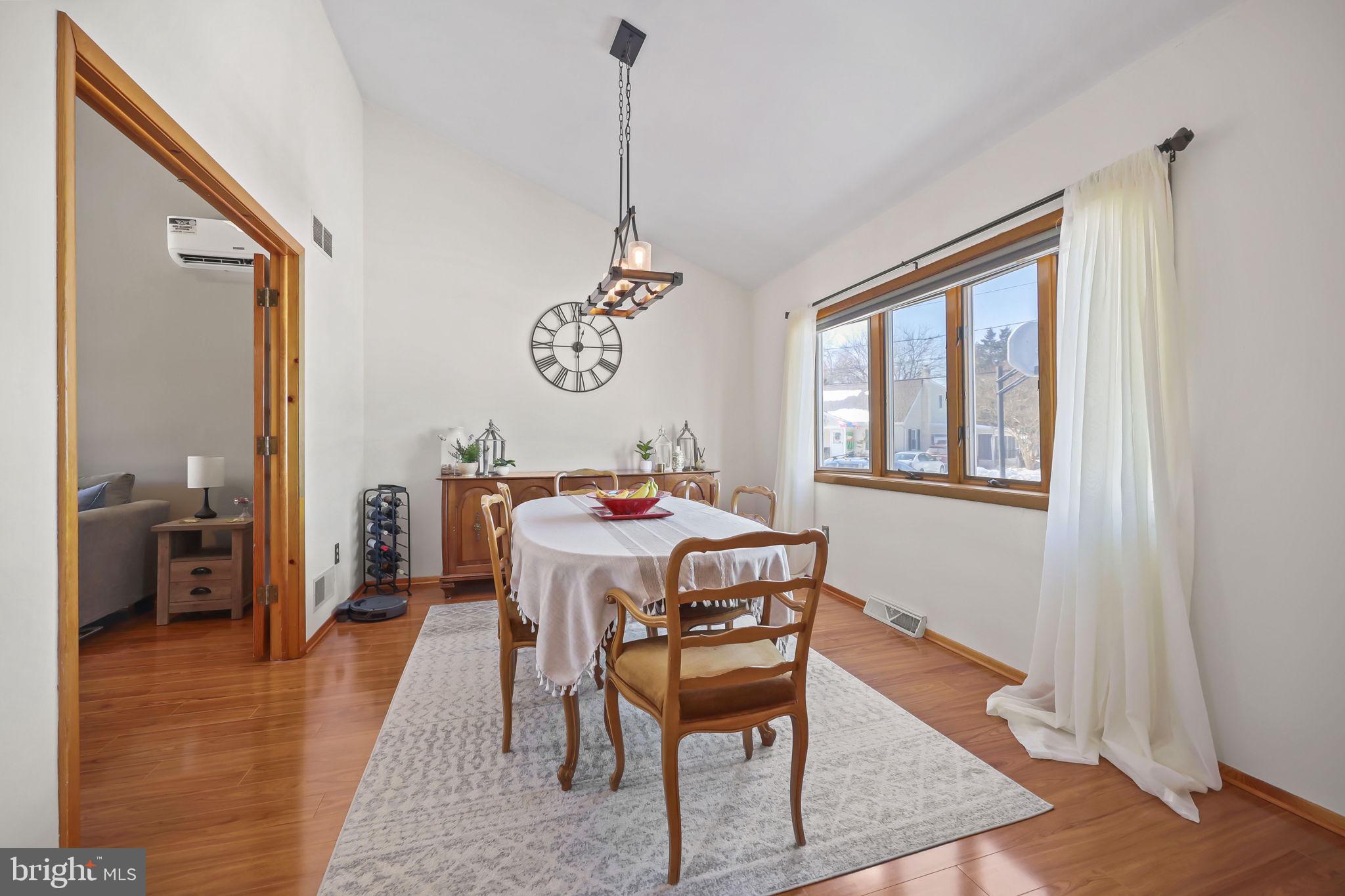 17 Maguire Road Hamilton, NJ 08690 - Photo 8 of 37 a dining room with a wooden table and chairs
