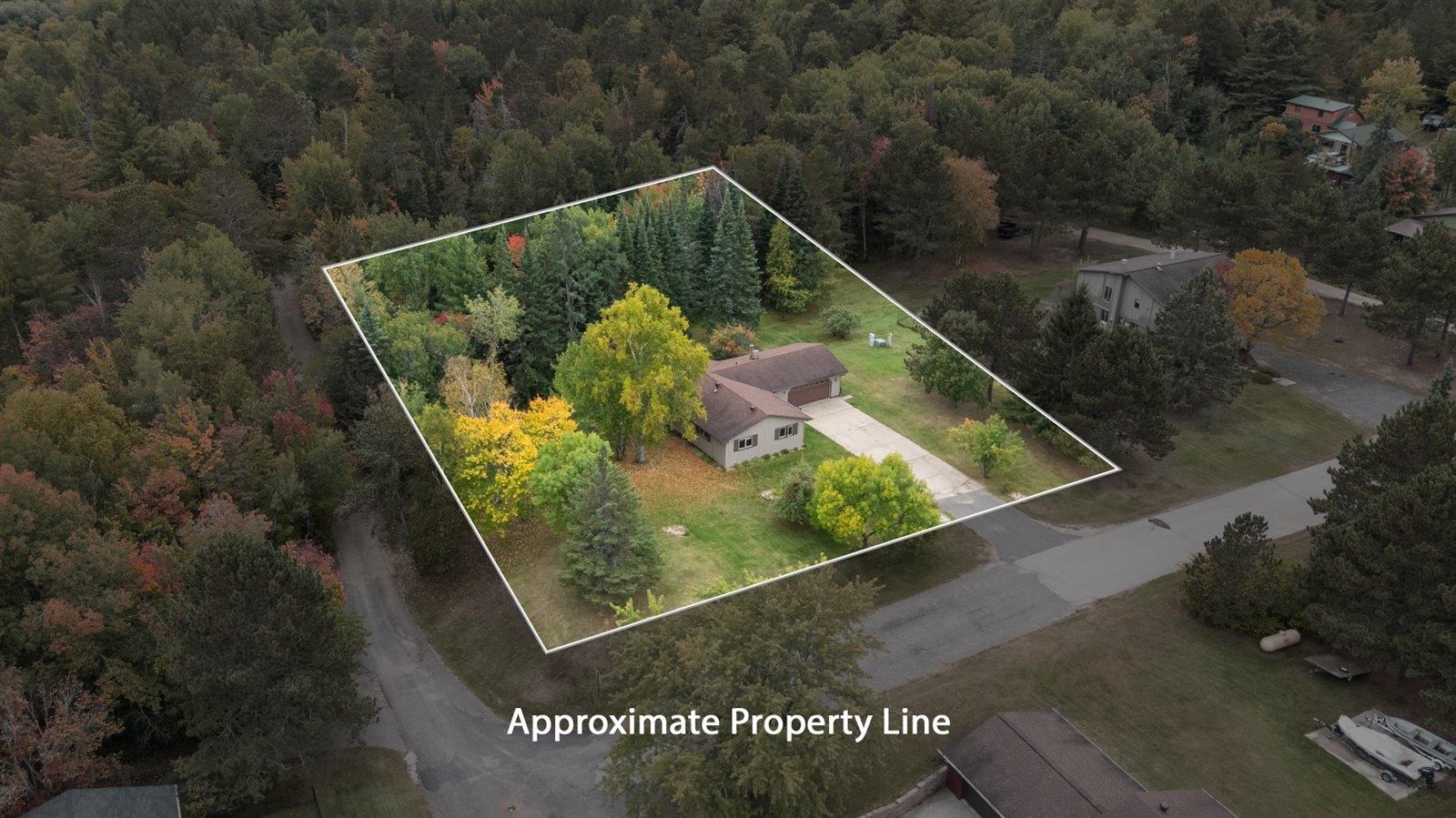 236 East Ahola Road Ely, MN 55731 - Photo 26 of 27 Aerial view of property and surrounding area with a heavily wooded area and property parcel outlined