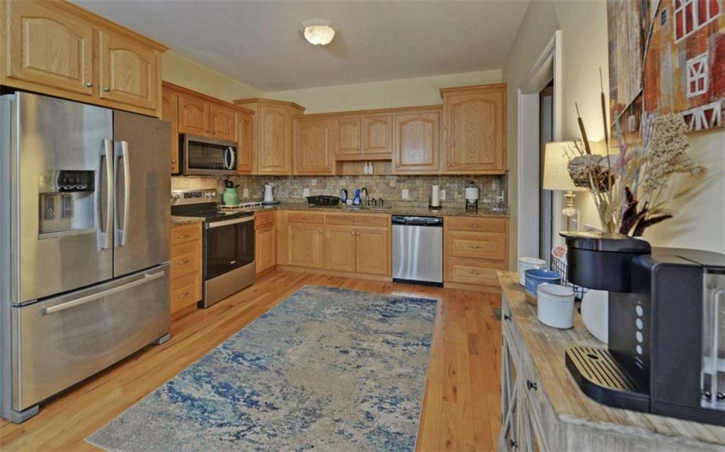 234 Dh Green Road Demorest, GA 30535 - Photo 11 of 57 a kitchen with stainless steel appliances granite countertop a refrigerator a stove top oven a sink and dishwasher