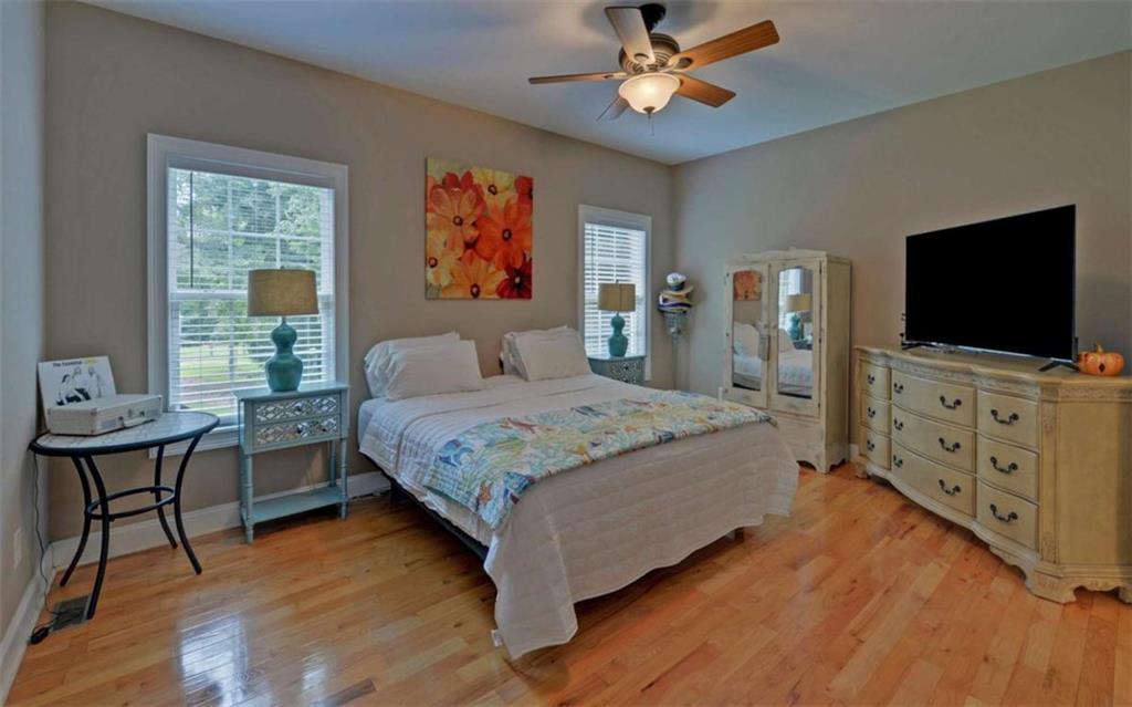 234 Dh Green Road Demorest, GA 30535 - Photo 16 of 57 a bedroom with a bed and a flat screen tv