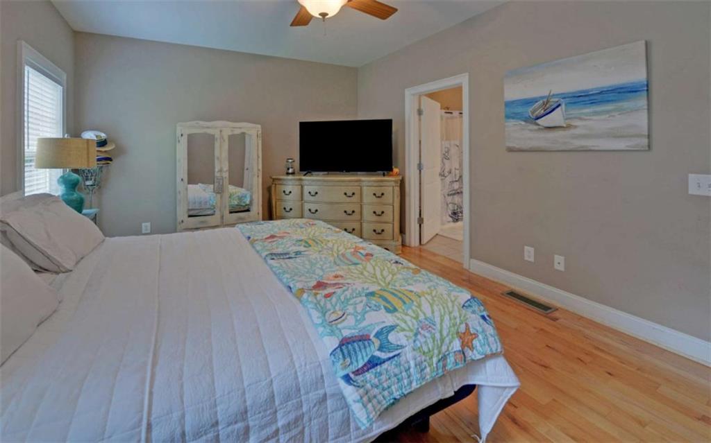 234 Dh Green Road Demorest, GA 30535 - Photo 17 of 57 a bedroom with a bed and a flat screen tv