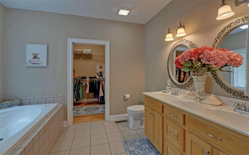 234 Dh Green Road Demorest, GA 30535 - Photo 19 of 57 a bathroom with a double vanity sink mirror and toilet
