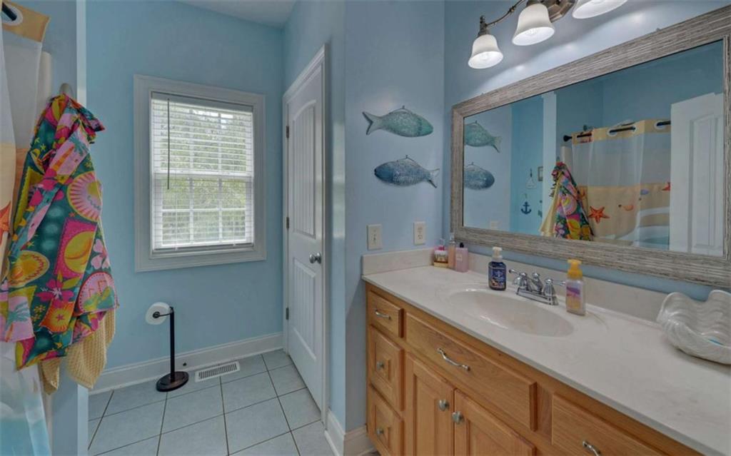 234 Dh Green Road Demorest, GA 30535 - Photo 24 of 57 a bathroom with a sink vanity and a mirror