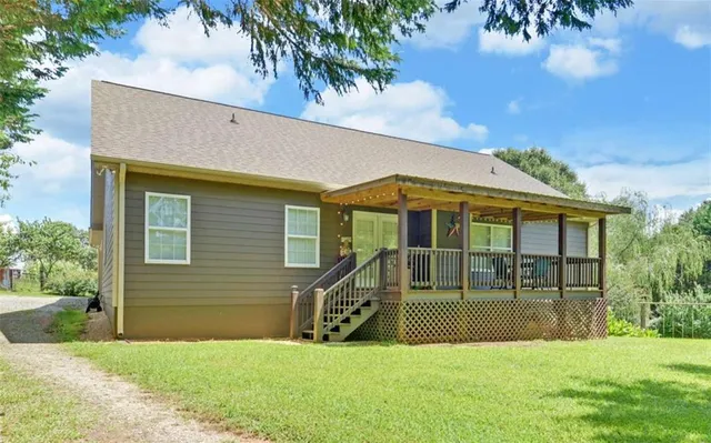 a view of a backyard with a garden and entertaining space