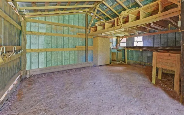 a yellow house with trees in front of it