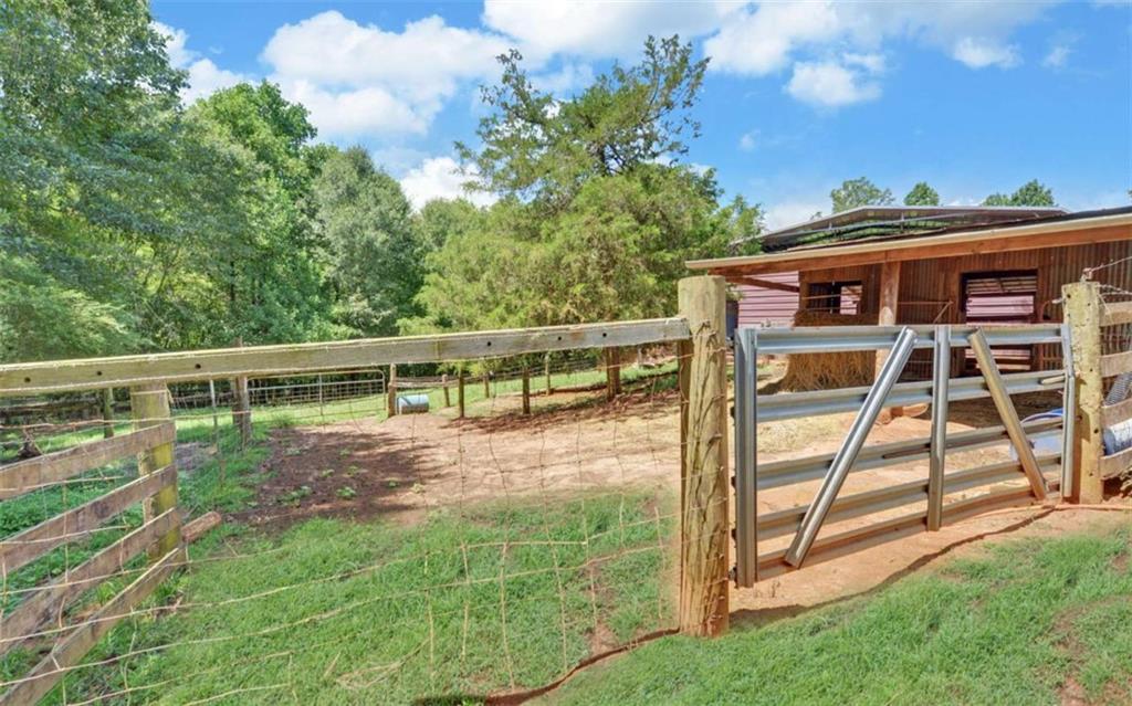 234 Dh Green Road Demorest, GA 30535 - Photo 43 of 57 a view of a deck with a big yard potted plants and large tree