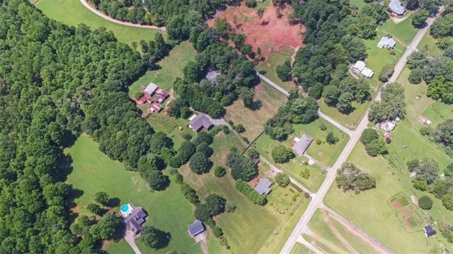 aerial view of a house with a yard balcony