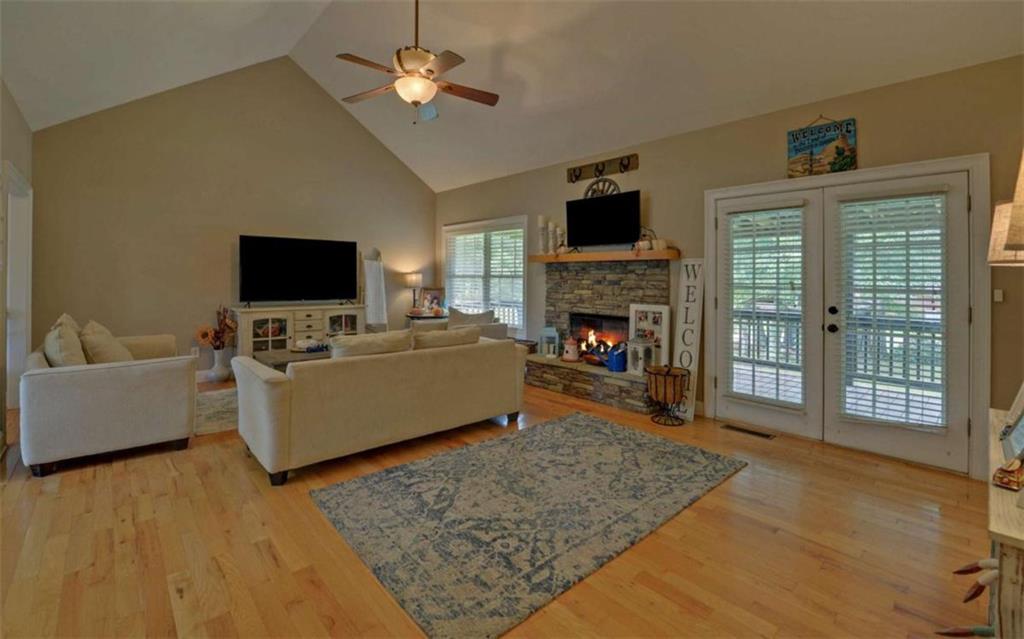 234 Dh Green Road Demorest, GA 30535 - Photo 7 of 57 a living room with furniture a fireplace and a flat screen tv