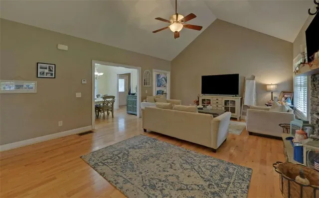 a view of a dining room with furniture and chandelier