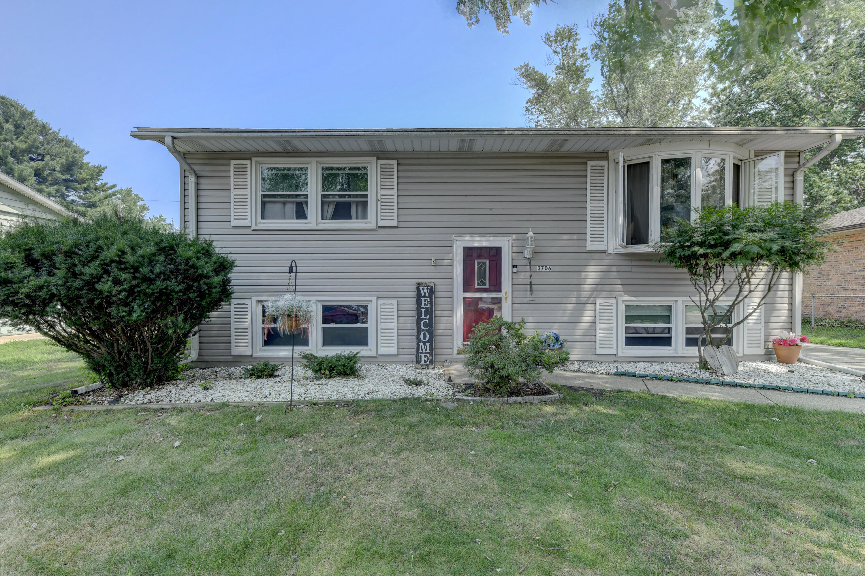 3706 Lexington Road Michigan City, IN 46360 - Photo 1 of 22 a front view of house with yard and outdoor seating