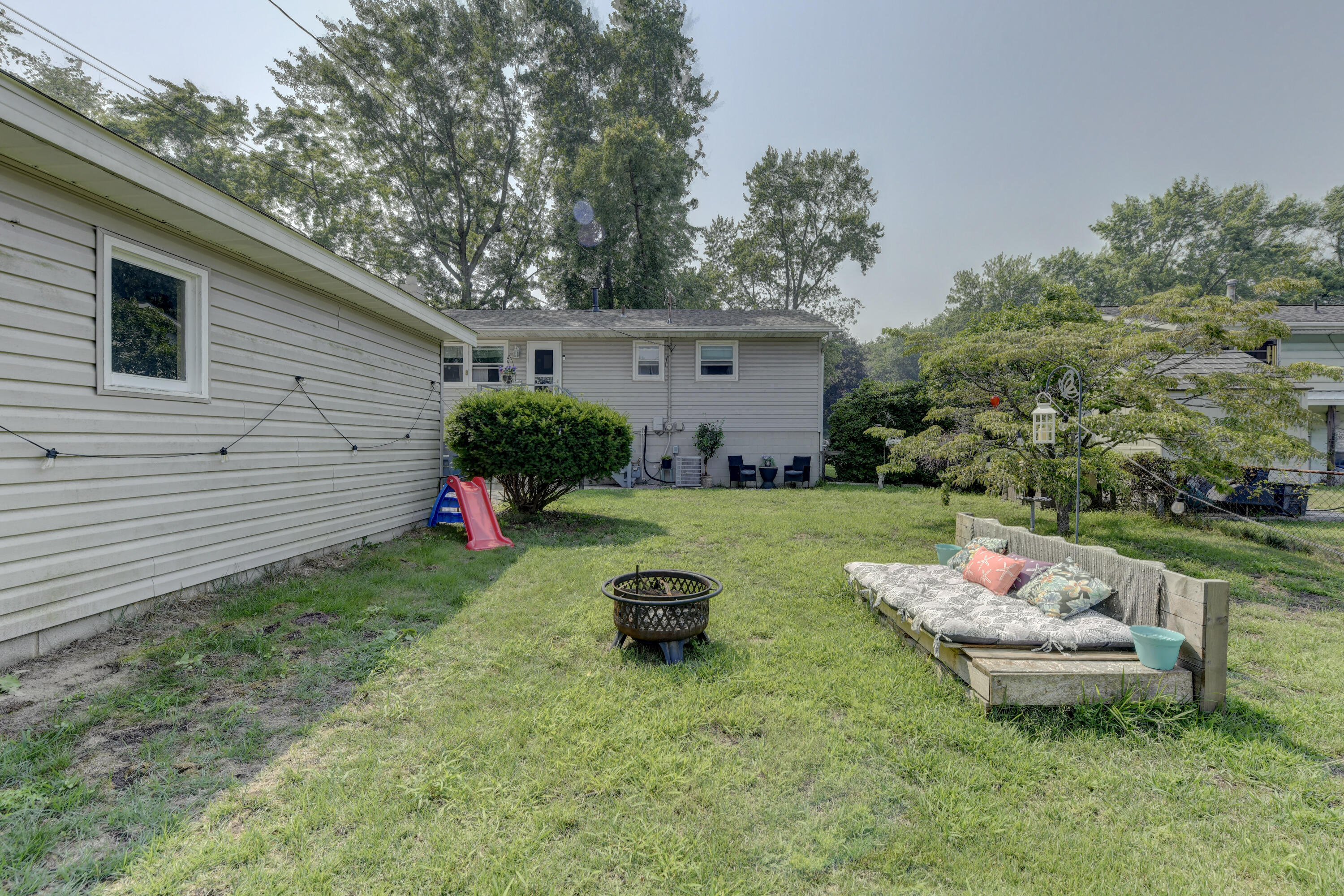 3706 Lexington Road Michigan City, IN 46360 - Photo 21 of 22 a backyard of a house with outdoor seating