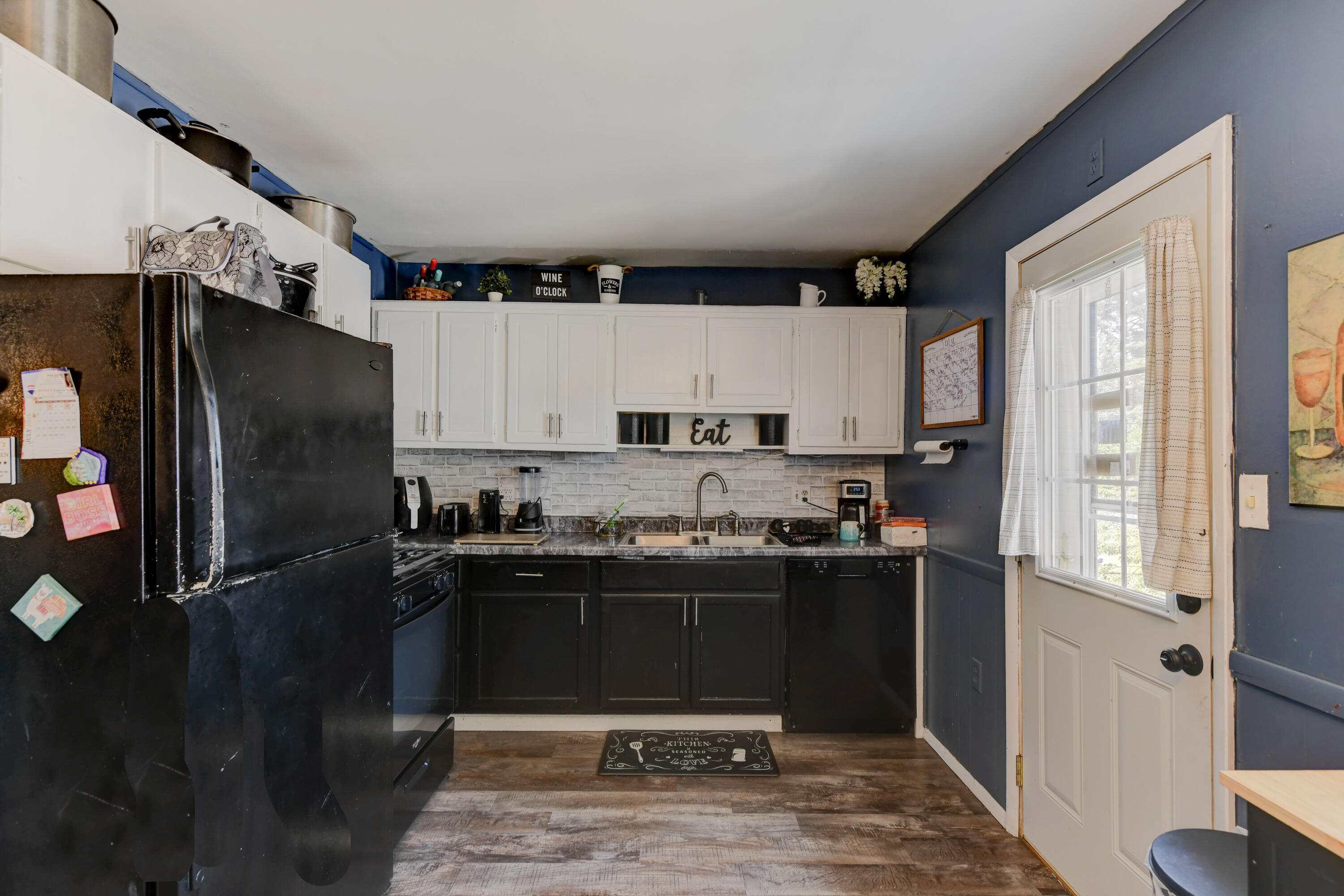 3706 Lexington Road Michigan City, IN 46360 - Photo 5 of 22 a kitchen with stainless steel appliances granite countertop a refrigerator and a sink