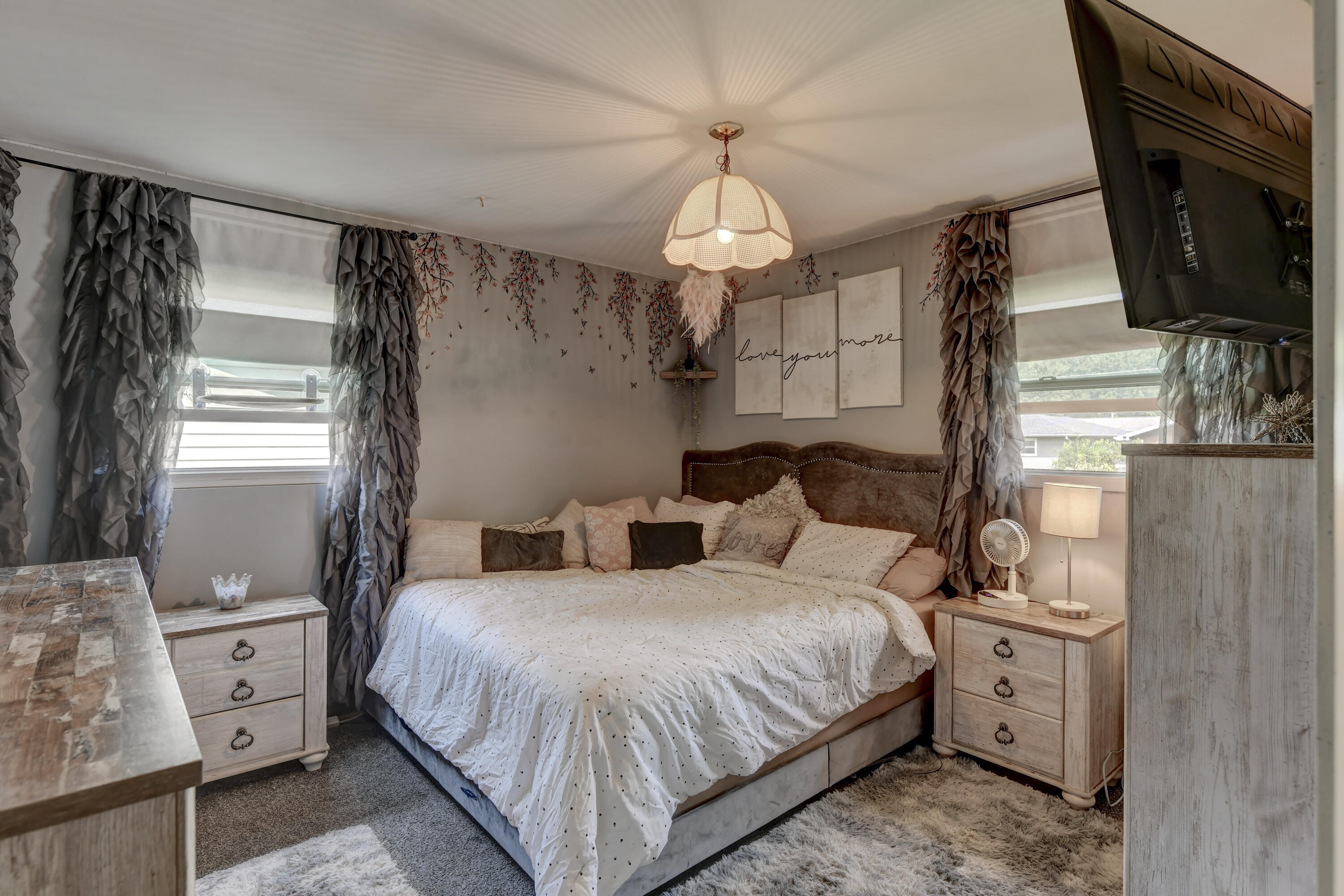 3706 Lexington Road Michigan City, IN 46360 - Photo 10 of 22 a bedroom with a bed and a chandelier