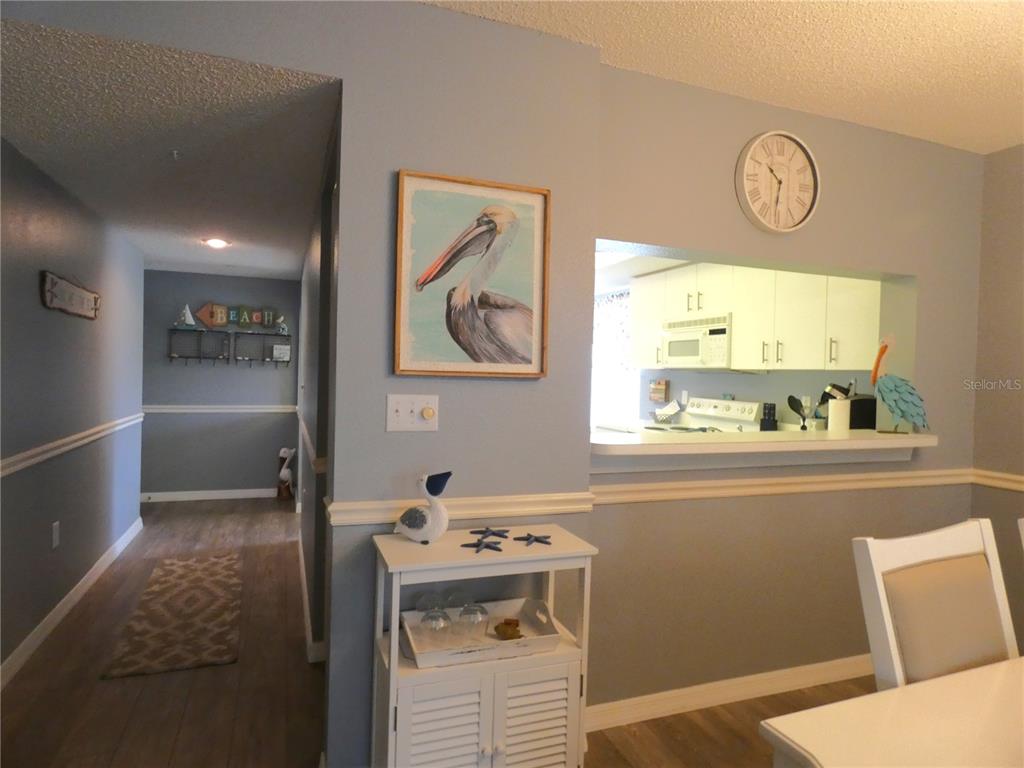 9320 Clubside Circle, Unit 2208 Sarasota, FL 34238 - Photo 11 of 41 a view of bathroom with window and wooden floor