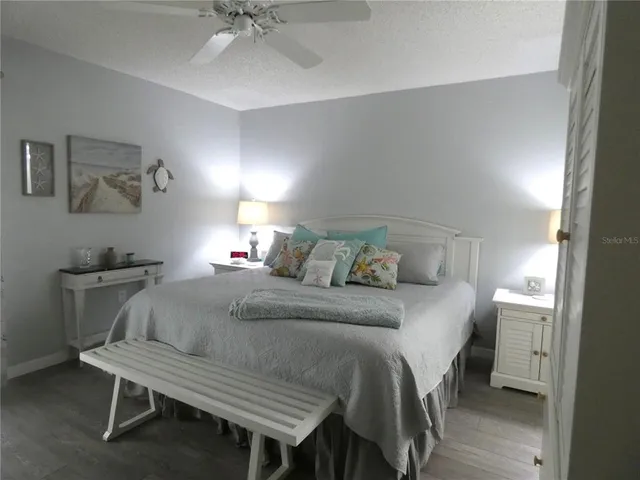 a bedroom with a bed and a table in it