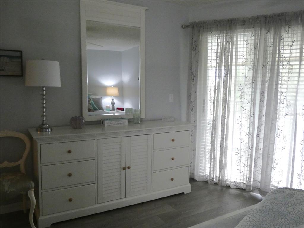 9320 Clubside Circle, Unit 2208 Sarasota, FL 34238 - Photo 16 of 41 a bathroom with a sink and a mirror