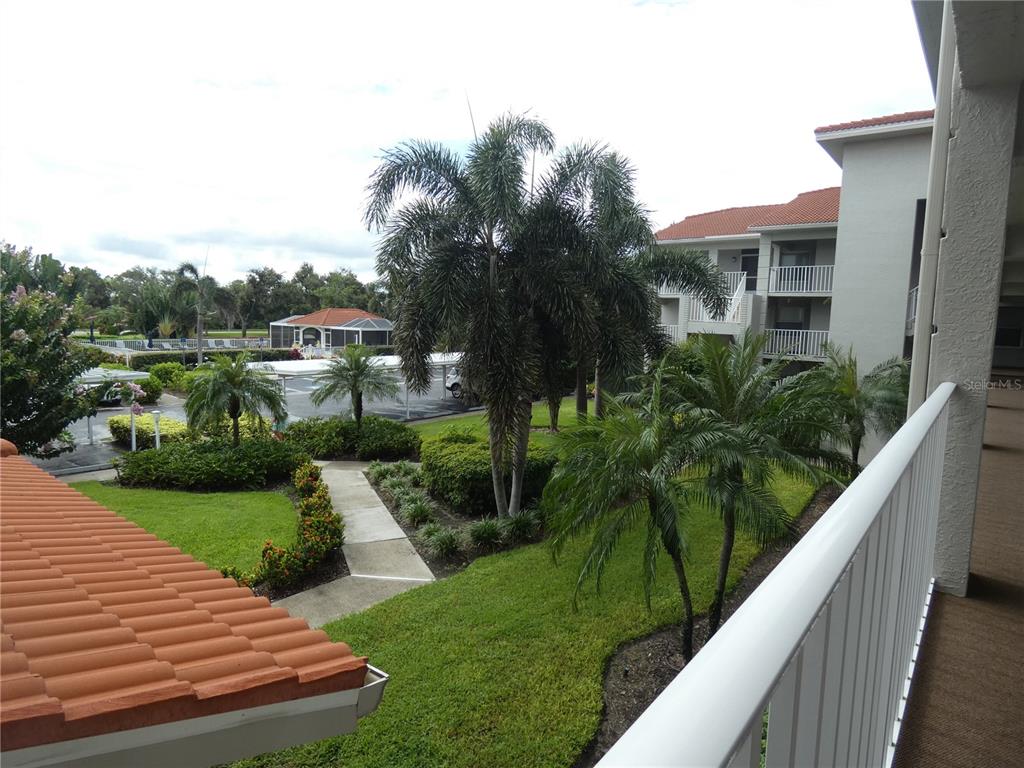9320 Clubside Circle, Unit 2208 Sarasota, FL 34238 - Photo 2 of 41 a view of a house with a yard