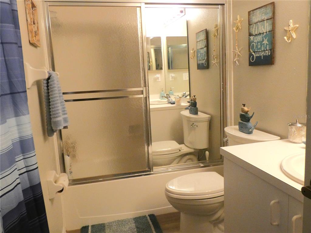 9320 Clubside Circle, Unit 2208 Sarasota, FL 34238 - Photo 21 of 41 a bathroom with a sink toilet and shower