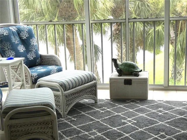 a living room with a couch and a large window