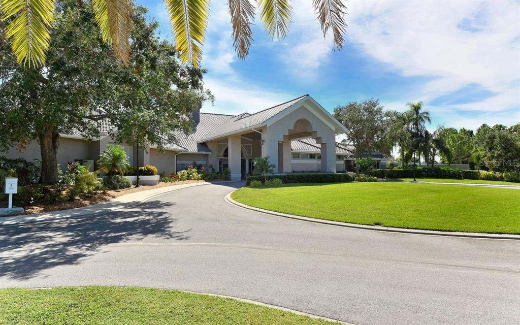 9320 Clubside Circle, Unit 2208 Sarasota, FL 34238 - Photo 27 of 41 a view of house with outdoor space and street view