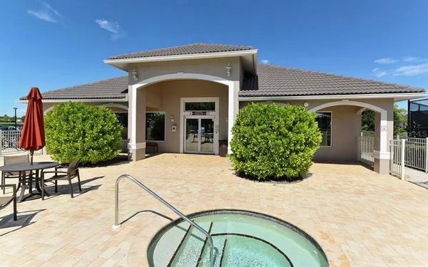 a view of a swimming pool with a yard