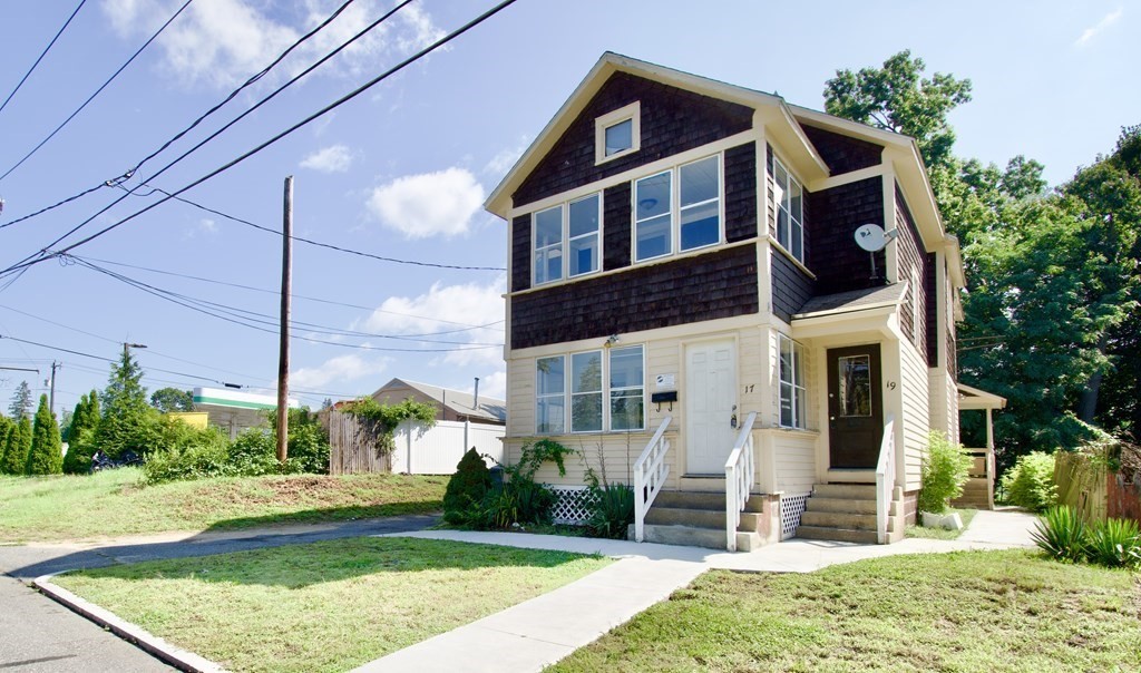 a front view of a house with garden