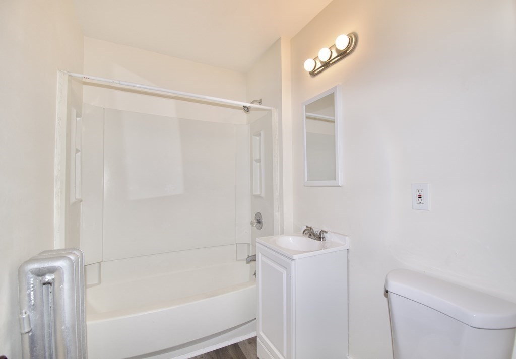 19 Ambrose Street Springfield, MA 01109 - Photo 29 of 32 a bathroom with a shower a toilet and sink