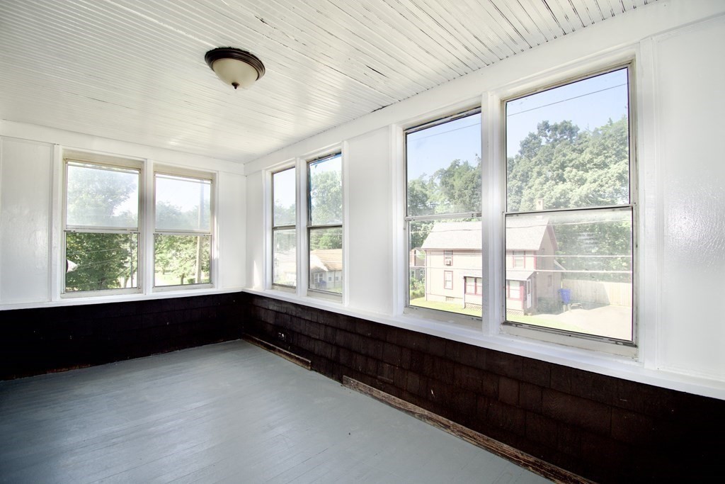 19 Ambrose Street Springfield, MA 01109 - Photo 30 of 32 a view of an empty room with a window and a ceiling fan