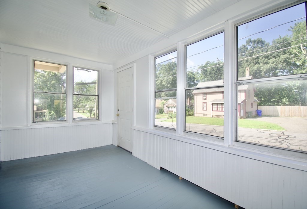 19 Ambrose Street Springfield, MA 01109 - Photo 3 of 32 a view of an empty room with large windows