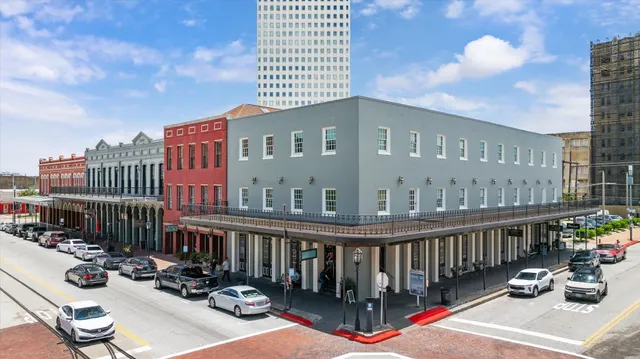 a front view of a building with sitting area
