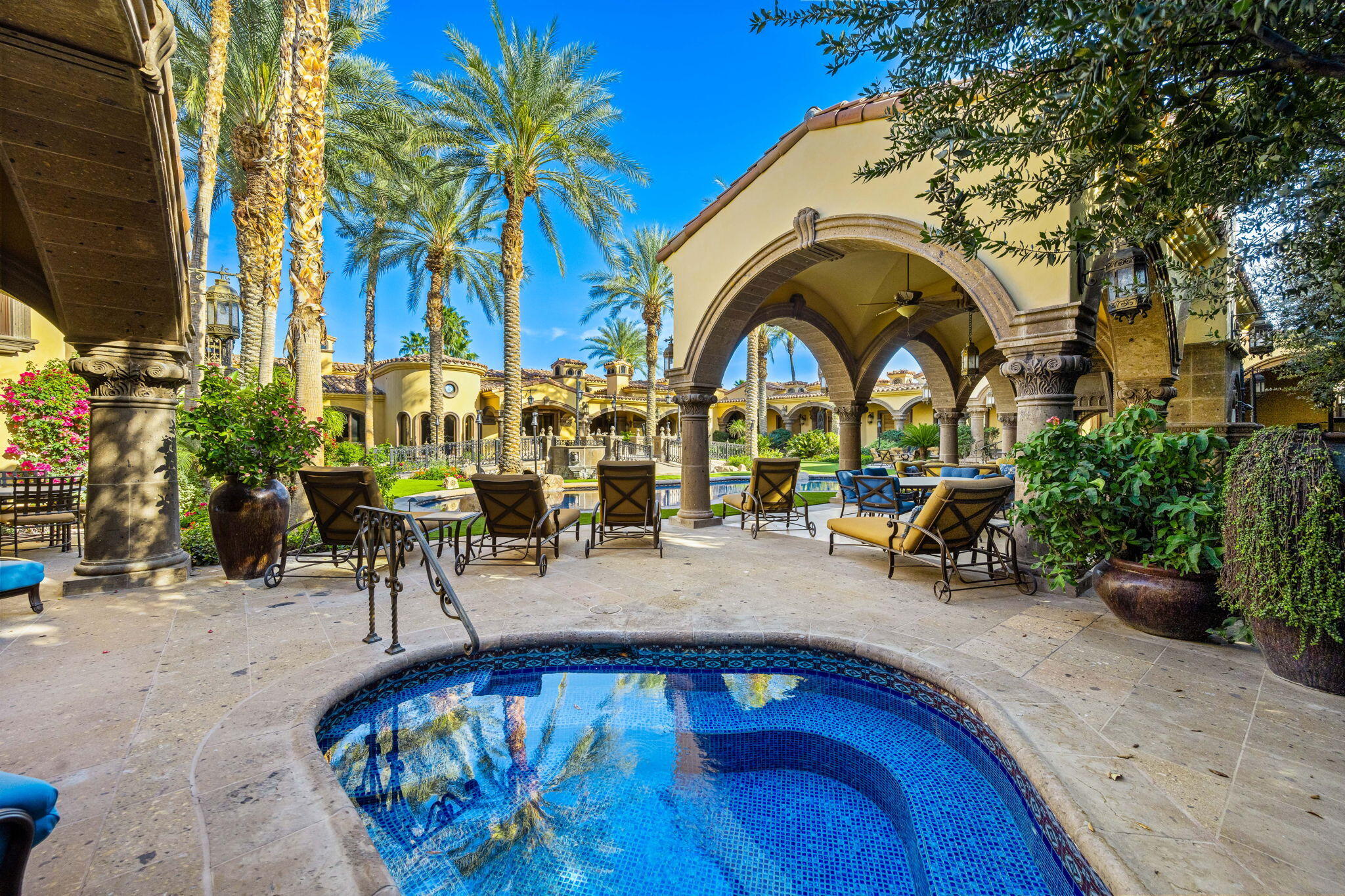 14 Strauss Terrace Rancho Mirage, CA 92270 - Photo 16 of 115 a view of swimming pool with outdoor seating and plants