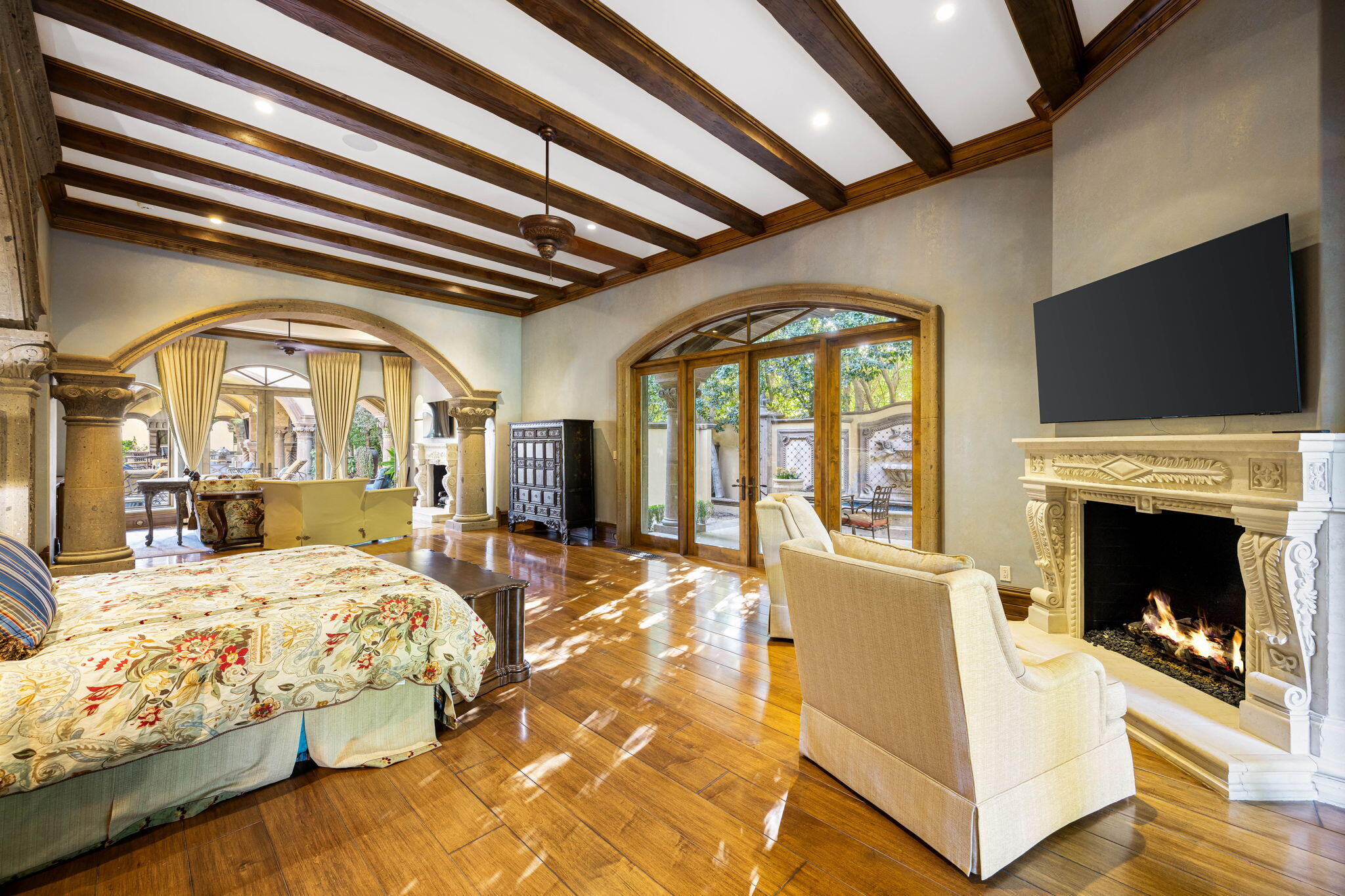 14 Strauss Terrace Rancho Mirage, CA 92270 - Photo 53 of 115 a bedroom with a bed and a fireplace