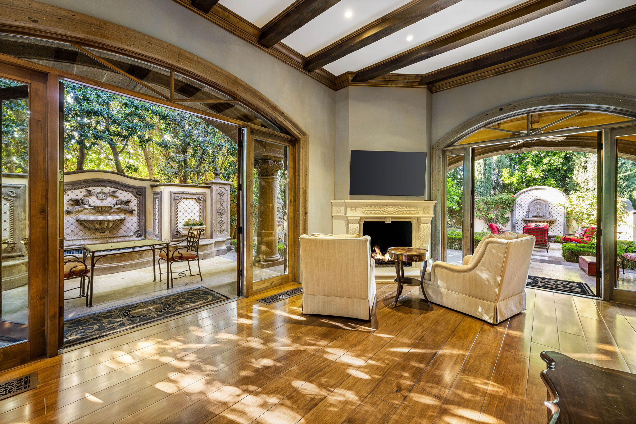 14 Strauss Terrace Rancho Mirage, CA 92270 - Photo 54 of 115 a living room with fireplace furniture and a floor to ceiling window
