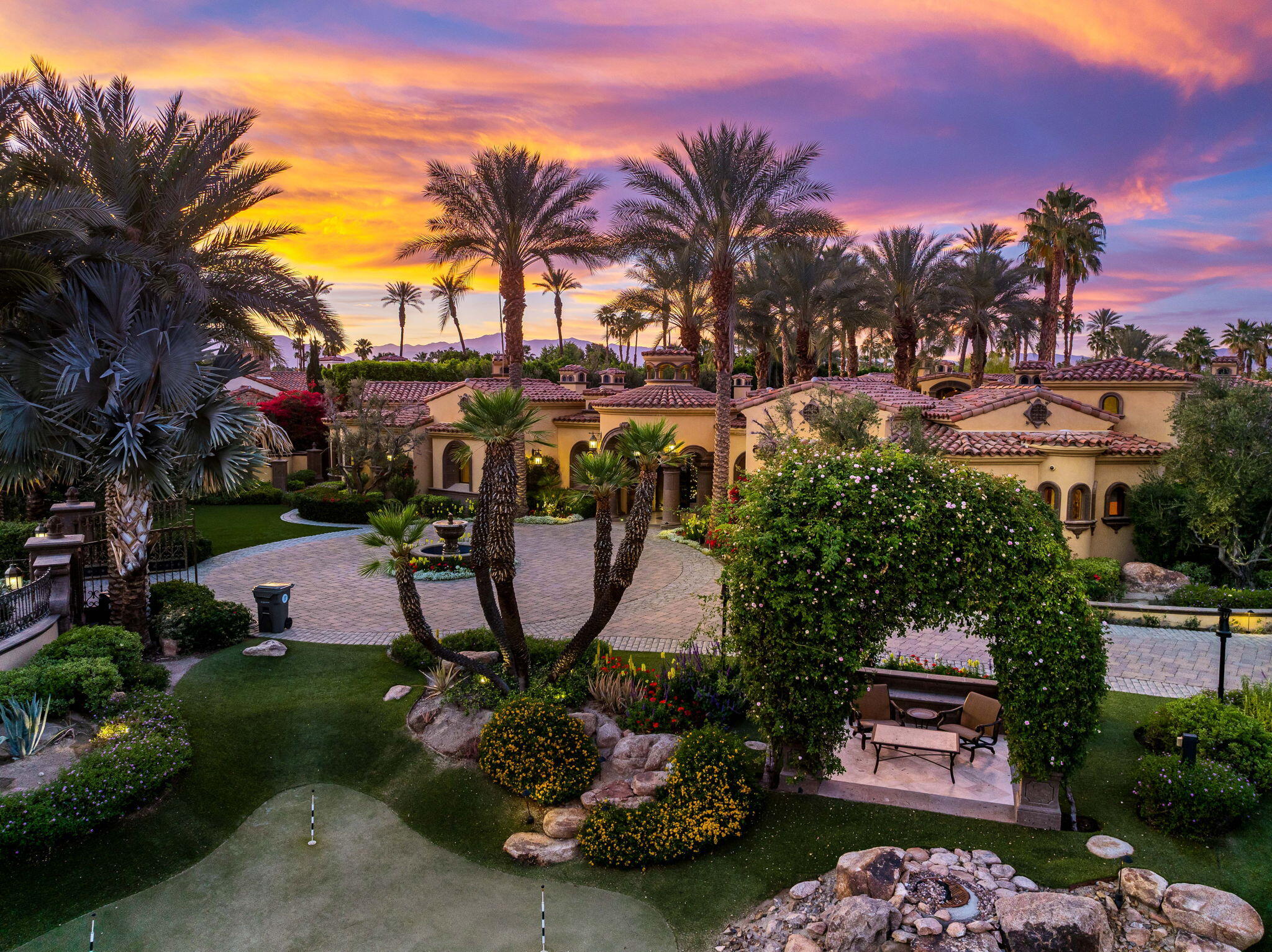 14 Strauss Terrace Rancho Mirage, CA 92270 - Photo 85 of 115 a view of a swimming pool with a patio and a garden