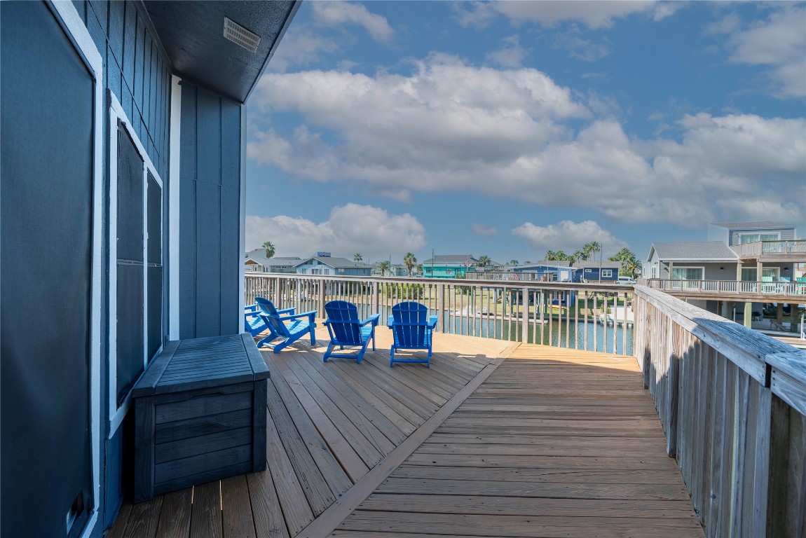 4729 Jolly Roger Road Jamaica Beach, TX 77554 - Photo 12 of 45 a view of a balcony with wooden floor