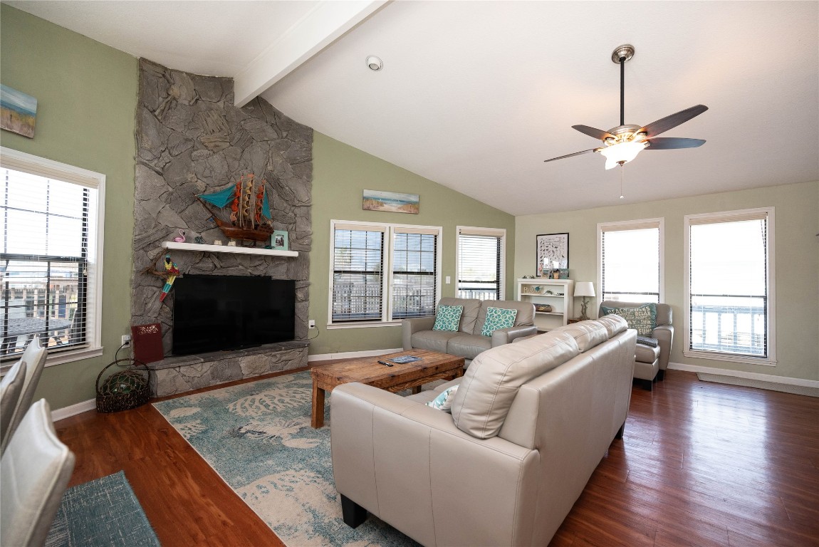 4729 Jolly Roger Road Jamaica Beach, TX 77554 - Photo 15 of 45 a living room with furniture fireplace and flat screen tv