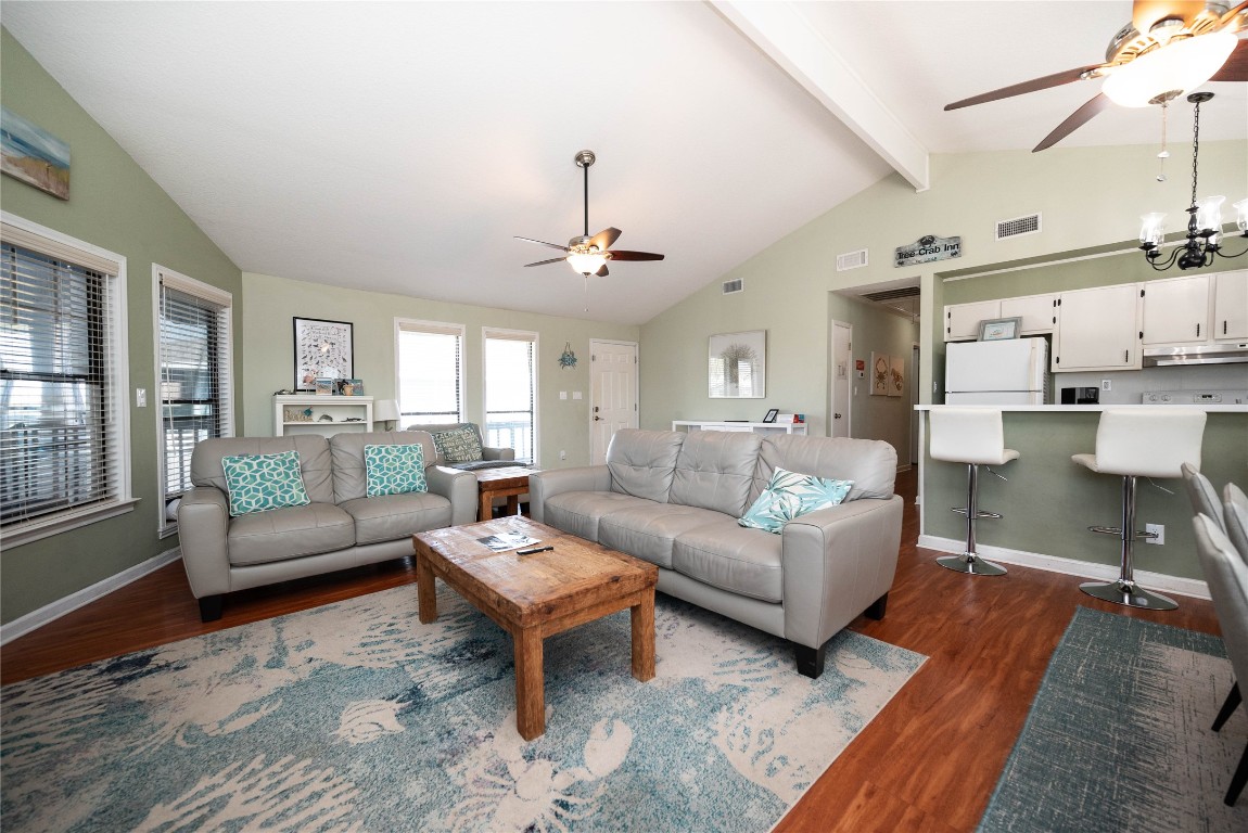 4729 Jolly Roger Road Jamaica Beach, TX 77554 - Photo 17 of 45 a living room with furniture and a large window