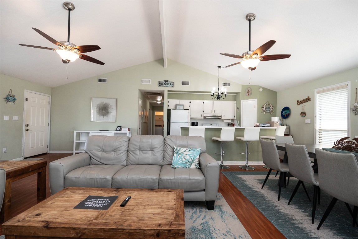 4729 Jolly Roger Road Jamaica Beach, TX 77554 - Photo 21 of 45 a living room with furniture and a chandelier