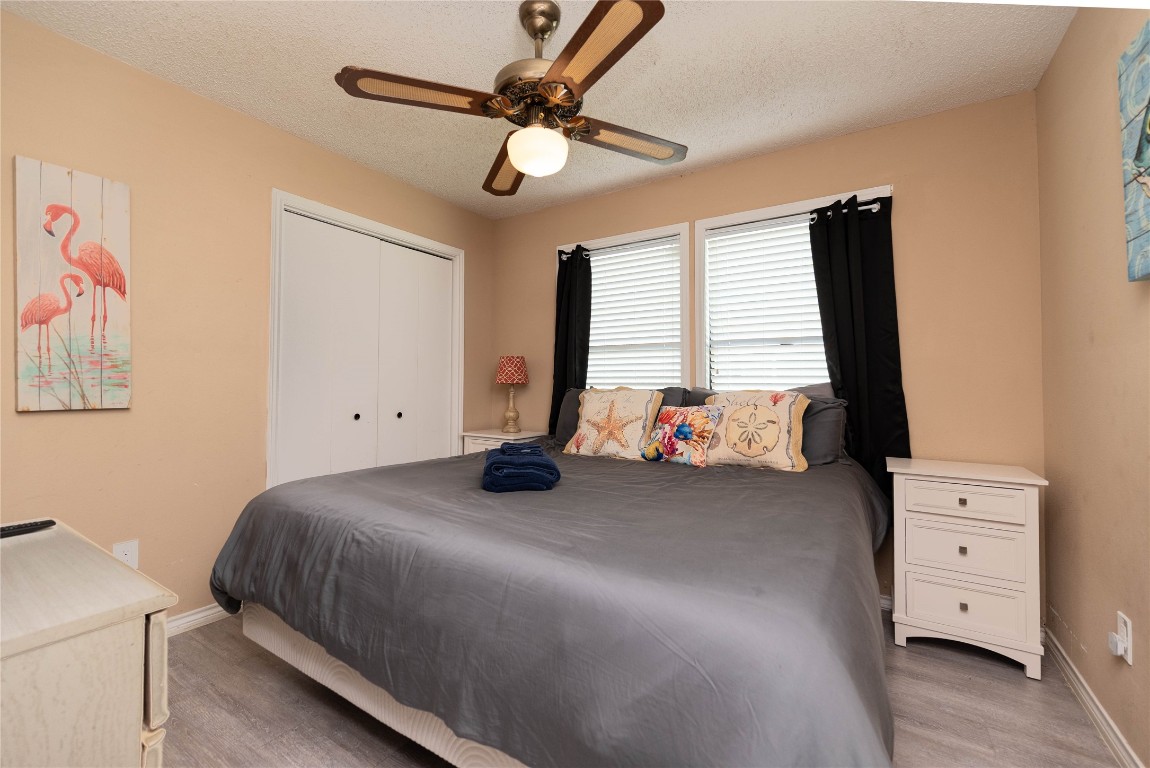4729 Jolly Roger Road Jamaica Beach, TX 77554 - Photo 28 of 45 a bedroom with a bed and a tv