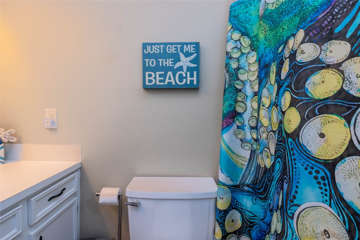 4729 Jolly Roger Road Jamaica Beach, TX 77554 - Photo 36 of 45 a bathroom with a toilet and a sink