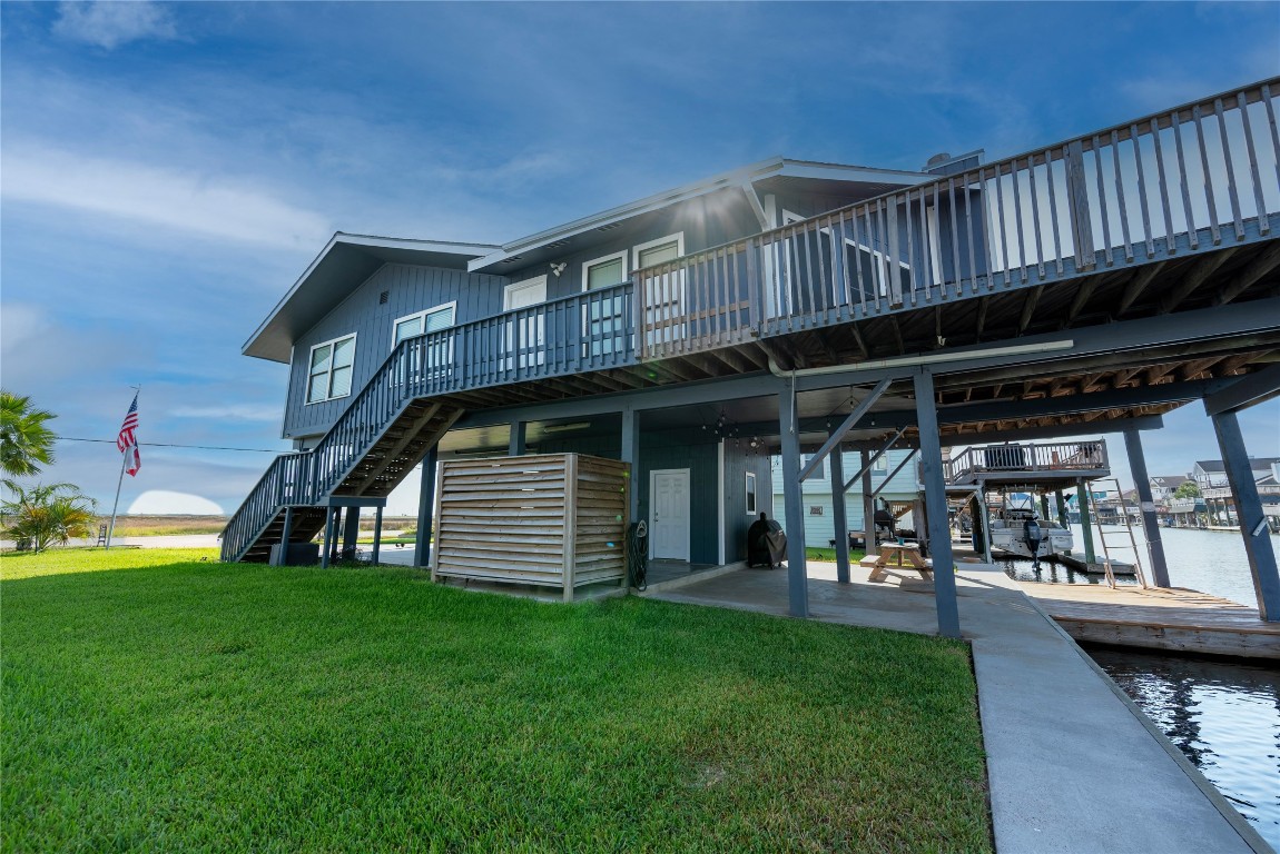 4729 Jolly Roger Road Jamaica Beach, TX 77554 - Photo 37 of 45 a view of a backyard with sitting area