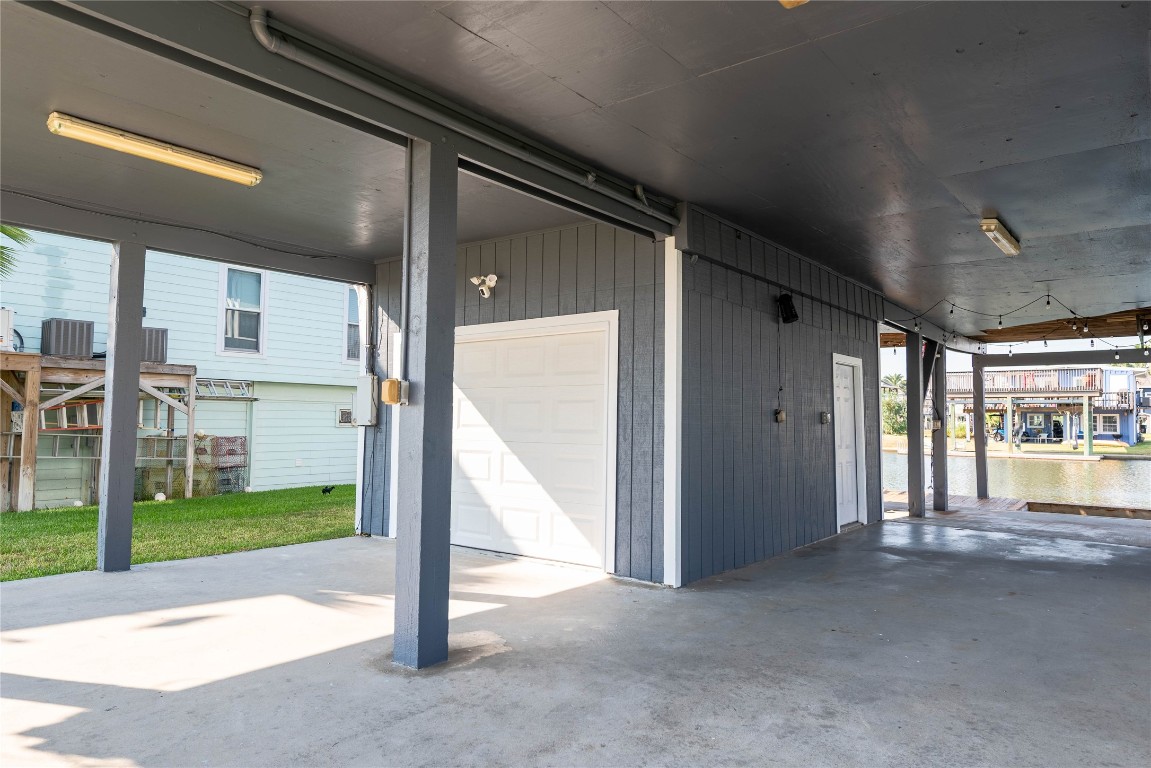 4729 Jolly Roger Road Jamaica Beach, TX 77554 - Photo 39 of 45 a view of a porch with a floor to ceiling window and a room